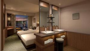 Ένα ή περισσότερα κρεβάτια σε δωμάτιο στο The Gate Hotel Sapporo by Hulic