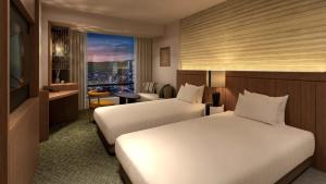 Ένα ή περισσότερα κρεβάτια σε δωμάτιο στο The Gate Hotel Sapporo by Hulic +10 φωτογραφίες