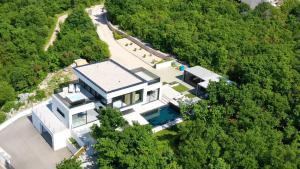 an aerial view of a house in the woods at Luxury Villa Cloer, Jadranovo - Sauna,Steam room, 2 Jacuzzis in Jadranovo