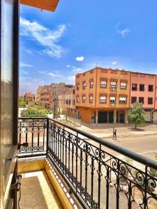 a balcony with a view of a street and buildings at Marrakech home in Marrakesh