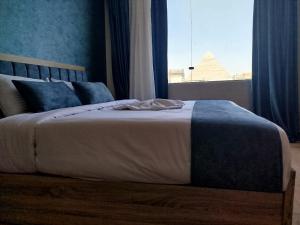 Postel nebo postele na pokoji v ubytování Red Pyramids