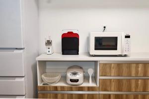 Een keuken of kitchenette bij New open 岸里玉出 Maison Le Jaune 玉子心斋桥道顿崛电车直达