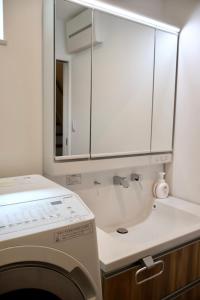 Een badkamer bij New open 岸里玉出 Maison Le Jaune 玉子心斋桥道顿崛电车直达