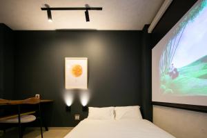 Llit o llits en una habitació de trive ozone2 trive kids バンテリンドーム ナゴヤ近く 大曽根駅 徒歩3分