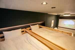Llit o llits en una habitació de trive ozone2 trive kids バンテリンドーム ナゴヤ近く 大曽根駅 徒歩3分