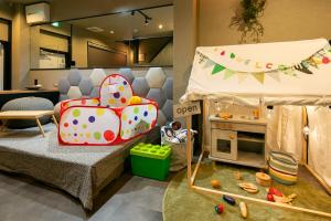 Llit o llits en una habitació de trive ozone2 trive kids バンテリンドーム ナゴヤ近く 大曽根駅 徒歩3分