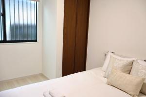 Krevet ili kreveti u jedinici u okviru objekta new open岸里玉出 Maison Le Blanc 白練 心斋桥道顿崛通天阁电车直达