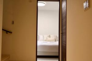 Krevet ili kreveti u jedinici u okviru objekta new open岸里玉出 Maison Le Blanc 白練 心斋桥道顿崛通天阁电车直达