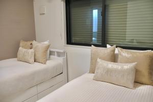 Krevet ili kreveti u jedinici u okviru objekta new open岸里玉出 Maison Le Blanc 白練 心斋桥道顿崛通天阁电车直达