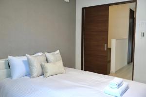Krevet ili kreveti u jedinici u okviru objekta new open岸里玉出 Maison Le Blanc 白練 心斋桥道顿崛通天阁电车直达