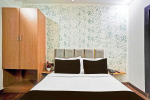 Postel nebo postele na pokoji v ubytování TWAMEV RESIDENCY