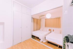 Postel nebo postele na pokoji v ubytování Showa Bloom Shinjuku 202