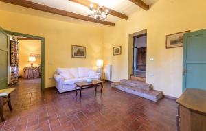 a living room with a couch and a table at Awesome Home In Campiglia Marittima in Campiglia Marittima