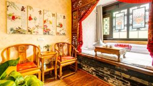Posezení v ubytování Pingyao Xinglongyi Inn