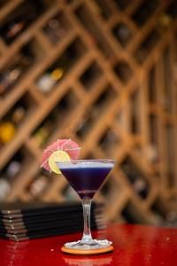 a blue drink in a glass sitting on a table at Hotel Gangotri Pvt Ltd in Bharatpur