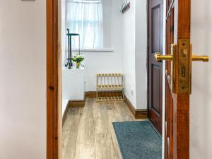 an open door to a room with a window at Lavender Cottage in Keswick +10 photos