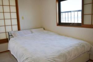 Letto o letti in una camera di Ocean View House Hannan 3rd