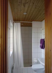 a bathroom with a shower and a toilet and a sink at "Lærkehuset" Right By Kalundborg Fjord in Kalundborg