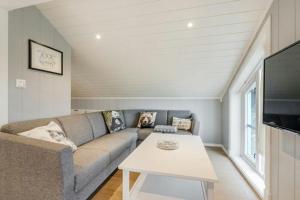 a living room with a couch and a table at High-Standard Cabin In Beautiful Rauland in Rauland