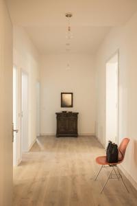 an empty room with a chair and a table at Holiday Apartment In Manor House On Rügen in Poseritz