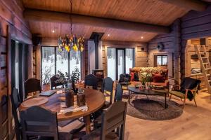 a living room with a table and a couch at Cabin With Great Fishing At Trysilfjellet in Jordet