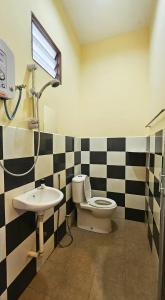 a bathroom with a toilet and a sink at Casa Yusika in Pantai Cenang +32 photos