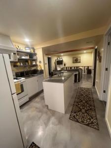 a kitchen with a sink and a counter in it at the Red Roof Farmhouse in Nampa