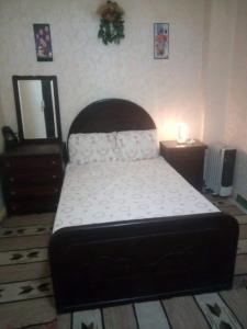 a bedroom with a bed and a dresser and a mirror at Affordable downtown studio steps to sea free wifi in Alexandria