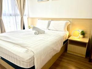 Postel nebo postele na pokoji v ubytování Ipoh Tambun Cove Luxe Premium Suites + 42 fotografií