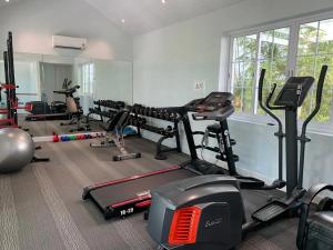 a gym with several exercise bikes and a treadmill at The Salt Villas Da Nang - 250sm 3BR, 4BA & Kitchen in Danang