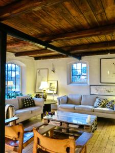 a living room with a couch and a table at Experience The Sea And Starling Murmuration in Kolby Kås +32 photos