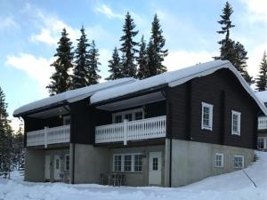 a house with snow on top of it at Cabin with great location in Lindvallen Sälen in Sälen