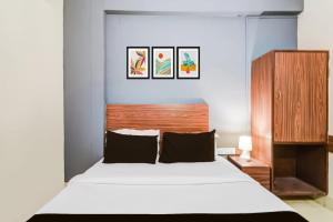 Postel nebo postele na pokoji v ubytování Hotel O Paradise Circle