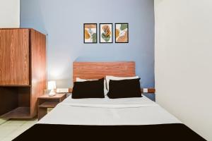 Postel nebo postele na pokoji v ubytování Hotel O Paradise Circle
