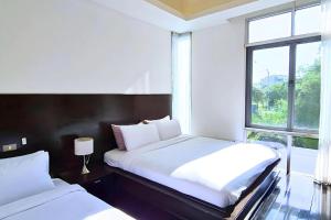 Postel nebo postele na pokoji v ubytování BM Pool Villa Pattaya
