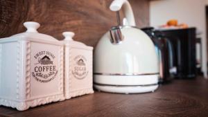 a counter with two bottles of coffee on a table at Flat Lora Pomorie in Pomorie