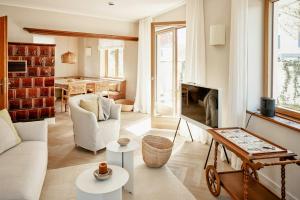 a living room with a couch and a table at Architectural Gem With Sea View in Norderney