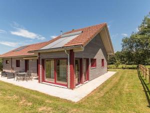 a house with a red roof and a patio at Gîte écologique calme proche Vosges, accueil PMR - FR-1-583-465 in Frahier-et-Châtebier