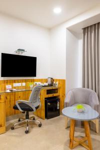 TV a/nebo společenská místnost v ubytování RR Residency