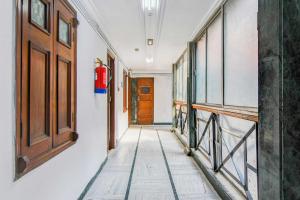 a hallway with a fire hydrant and a door at Collection O Lenin Sarani in Kolkata