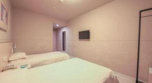 JinJiang Inn Datong Pingchengqiao客房内的一张或多张床位