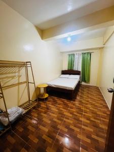 a room with a bed and a ladder in it at Brklyn Homestay in Banaue