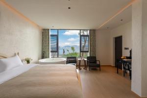 Dali Blue House Sea View B&B客房内的一张或多张床位