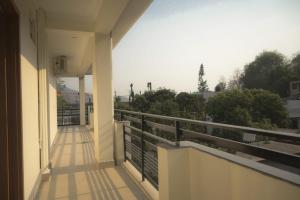 a balcony of a building with a view at Mount Valley Mama Cottage in Rishīkesh