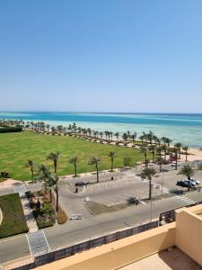 a view of the beach from the balcony of a resort at Royal Palace in King Abdullah Economic City