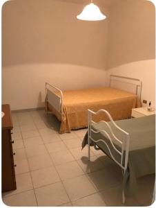 a hospital room with two beds and a lamp at Villa Maria in Andrano