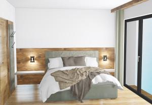 Un pat sau paturi într-o cameră la Kristall Apartments
