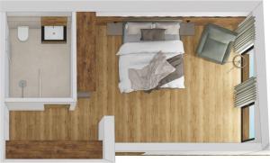 Un pat sau paturi într-o cameră la Kristall Apartments