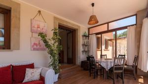 a living room with a table and a couch at FINCA LA GRANDA DE LA CONCHA in Nueva de Llanes