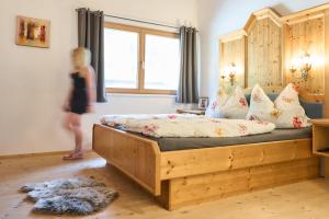 Ένα ή περισσότερα κρεβάτια σε δωμάτιο στο B&B Margit's Ranch Urlaub am Pferdehof